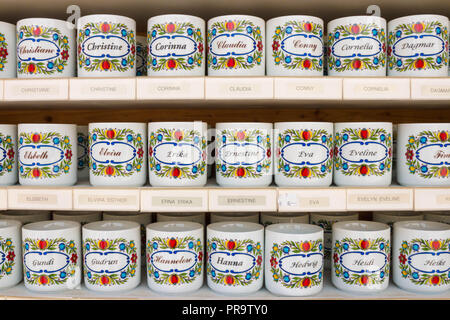 St. Gilgen, Austria - May 22, 2017: Personalized tea cups with female names on them for sale in a souvenir shop. Stock Photo