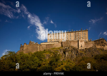 City landmark historic fortress which dominates the skyline on a sunny day  Edinburgh Castle south point The New Barracks  built on a volcanic rock Stock Photo