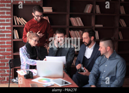 creative group of designers at a working meeting in the Studio. Stock Photo