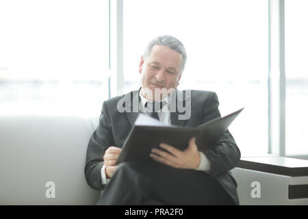 serious businessman studying business documents. business concept Stock Photo