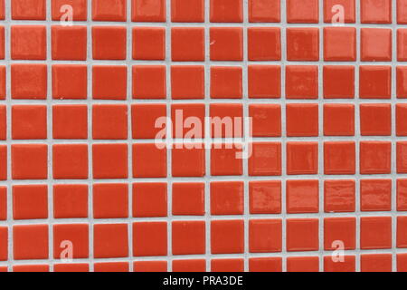 Red mosaic tiles on a wall Stock Photo