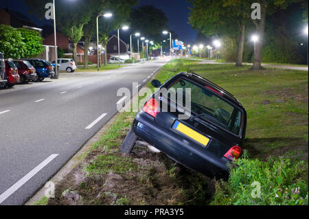 A car had driven into a ditch Stock Photo