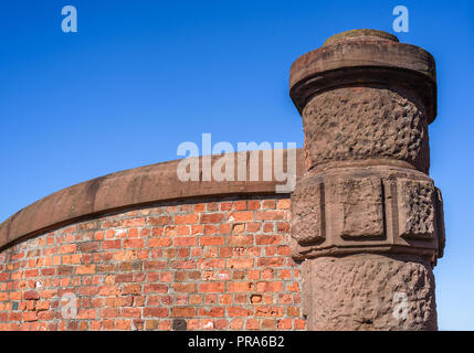 Historic sandstone gate post and brick wall at the Albert Dock, Liverpool, Merseyside, Uk. Stock Photo
