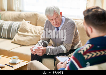Old Man in Therapy Session Stock Photo