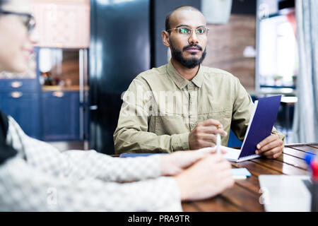 Bearded man discussing project at meeting Stock Photo