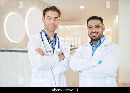Two Doctors Posing in Clinic Stock Photo