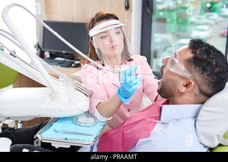 Female Dentist Working with Patient Stock Photo