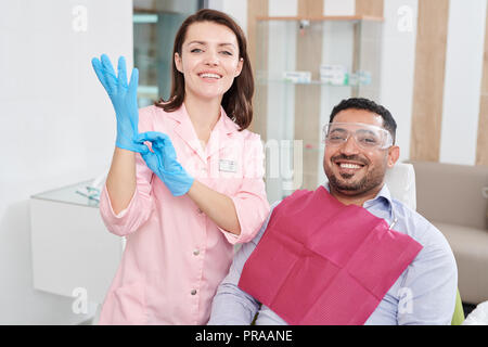Smiling Female Dentist Posing with Patient Stock Photo