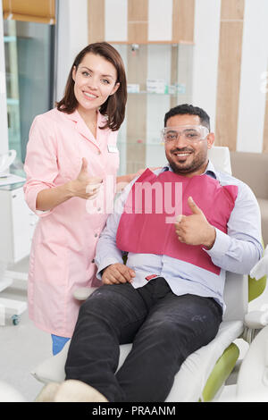 Female Dentist Posing with Patient Stock Photo
