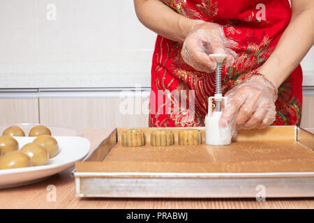 Asian chinese woman making moon cake in the kitchen at home Stock Photo