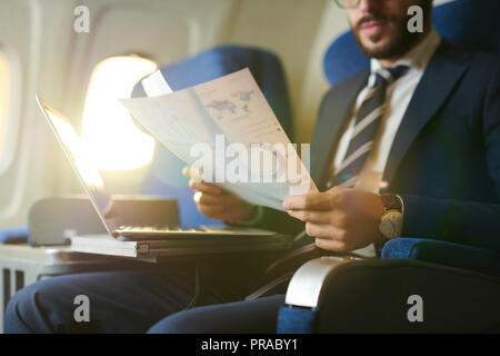 Businessman in Plane Stock Photo