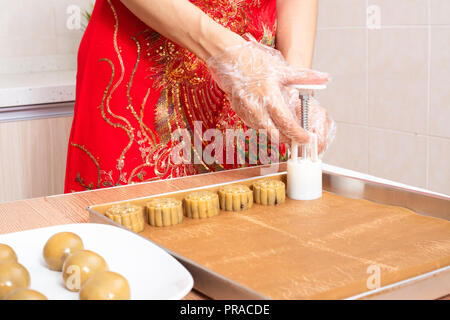 Asian chinese woman making moon cake in the kitchen at home Stock Photo