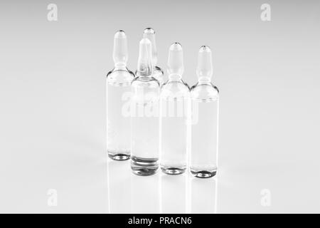 Ampoules with medicine on white background. Stock Photo