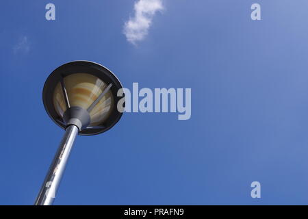 a street lamp post with blue sky and white cloud. time to walk or trip Stock Photo