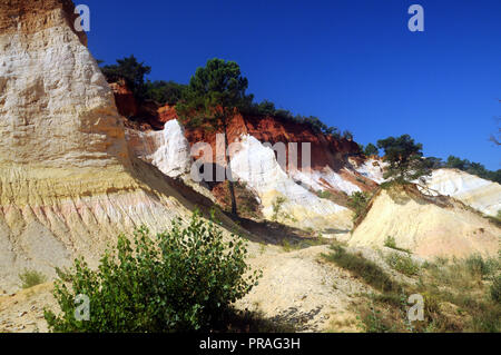 The coloured cliffs , the result of ochre extraction, at the Colorado Provencal de Rustrel in the Luberon region of the South of France. Stock Photo