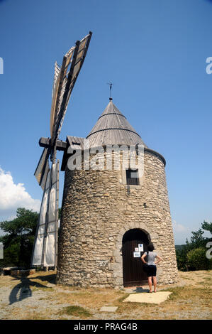 The windmill of St. Elzear de Montfuron on a hill outside the village of the same name the Alpes de Haute Provence in the south of France. Stock Photo