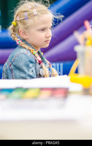 Portrait of a lovely smiling girl painting a picture Stock Photo - Alamy