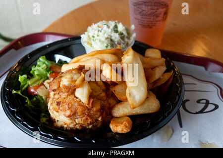 USA, Maryland MD Baltimore Lexington Market Faidleys Seafood lump crab meat crab cake with fries and cole slaw with a beer Stock Photo