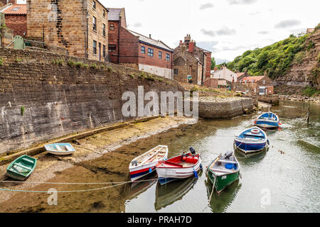 fishing boats in the river at Staithes, Scarborough, North Yorkshire Coast Stock Photo