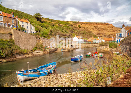 fishing boats in the river at Staithes, Scarborough, North Yorkshire Coast Stock Photo