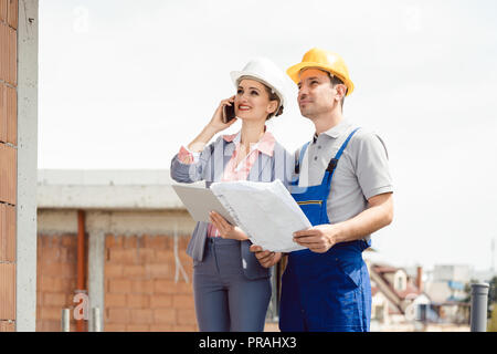 Project developer and construction worker on site Stock Photo