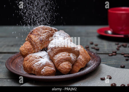 Fresh, tasty croissants with a cup of fragrant coffee Stock Photo