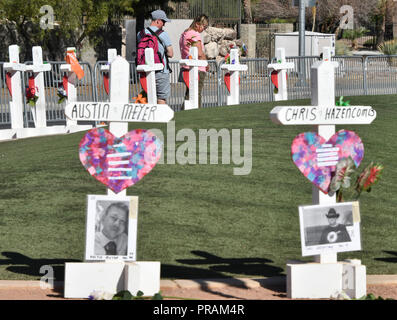 9-30-18. Las Vegas NV. Friends, family and visitors stop by and cope with lost of victims as white crosses were put up in memory of the 58 killed in Las Vegas mass 1yr year ago Sunday. October 1st 2018 Monday will mark the 1yr tragedy event as each of the crosses had the name and photo of the each victims. Fifty-eight died with 800 were injured from the shooting and with a year has passed, yet so many questions remain. Las Vegas police couldn't name a motive with the FBI is still trying to figure it out. Photo by Gene Blevins/LA DailyNews/ZumaPress (Credit Image: © Gene Blevins/ZUMA Wire) Stock Photo