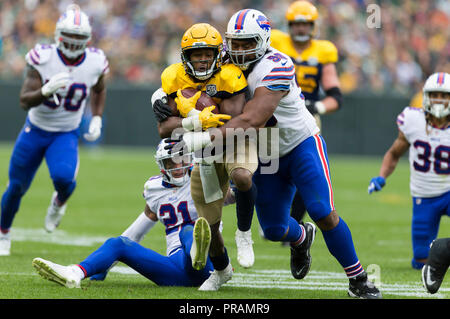 Green Bay, WI, USA. 30th Sep, 2018. Green Bay Packers running back Aaron Jones #33 rushes the ball during the NFL Football game between the Buffalo Bills and the Green Bay Packers at Lambeau Field in Green Bay, WI. John Fisher/CSM/Alamy Live News Stock Photo
