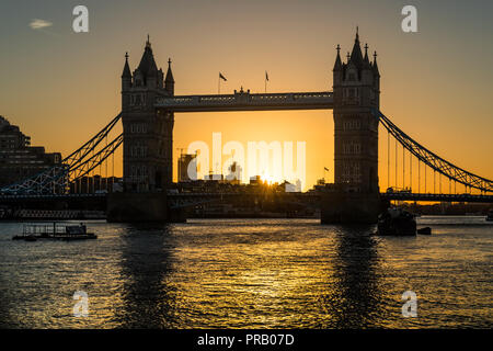 London, UK. 1st Oct, 2018. UK Weather: First day of October brings an intense sunrise over London Tower Bridge. Credit: Guy Corbishley/Alamy Live News Stock Photo