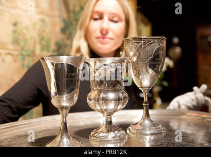 Knightsbridge, London,UK,1st October 2018,A Photocall took place for Bonhams Private Collections Sale in Knightsbridge, London. The Collections include VICTORIAN SILVER TROPHY CUP by Thomas Marsh & Co, Birmingham 1882 (2) Estimated at £ 1,200 - 1,400 and A VICTORIAN SILVER TROPHY CUP WON BY LORD LUCAN IN A BACKGAMMON GAME maker's mark 'WH' London 1844 estimated at £ 200 - 300 The sale is on the 3rd October at noon. Credit: Keith Larby/Alamy Live News Stock Photo