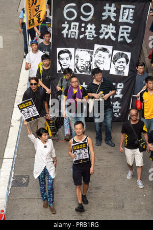 Hong Kong, Hong Kong SAR, China. 1st Oct, 2018. Pro democracy members of LegCo Claudia Mo Man-ching(L) and Raymond Chan Chi-chuen(M)National Day March in Hong Kong. On the 69th anniversary of the founding of the Peoples Republic of China, people take to the streets of Hong Kong Island to march, protest and have their views heard. Despite the recent banning of the Hong Kong National Party, Pro-Independence supporters were amongst the crowd. Joshua Wong stood firm under the Demosisto Party banner as calls go out for them to be banned next. Credit: Jayne Russell/ZUMA Wire/Alamy Live News Stock Photo