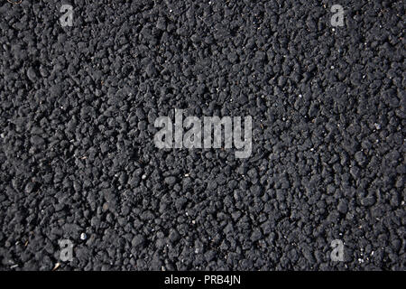 black tarmac texture useful as a background. Stock Photo