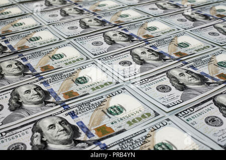 Scattered one hundred dollas banknotes close up background Stock Photo