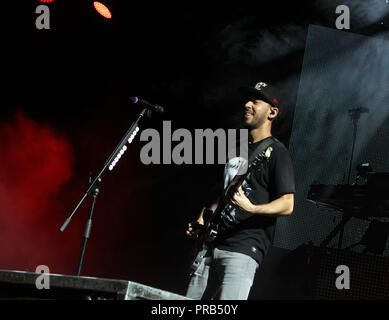 Mike Shinoda with Linkin Park performs on the opening night of their tour at the Cruzan Amphitheatre in West Palm Beach, Florida on August 8, 2014. Stock Photo