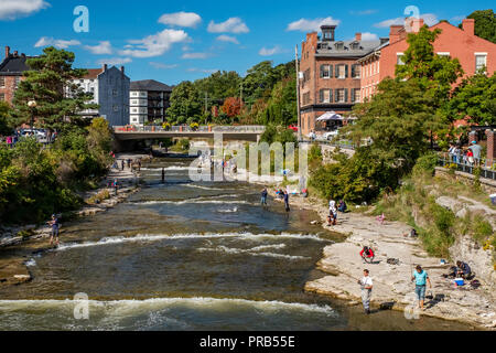 Port Hope, Ontario, Canada - September 22, 2018:  A view of the Ganaraska River in downtown Port Hope, with dozens of anglers hoping to catch salmon a Stock Photo