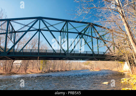 The metal pleasant valley bridge spanning the Farmington river on a sunny spring day in Pleasant Valley Connecticut. Stock Photo