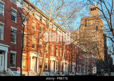 Afternoon sunlight shines on the historic buildings along Washington Square Park in Manhattan, New York City Stock Photo