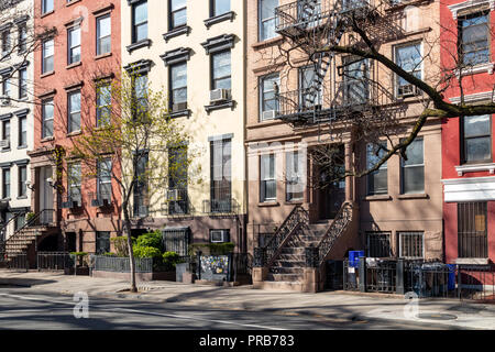 Old brownstone buildings along a quiet neighborhood street in Greenwich ...