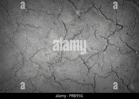 cracked asphalt texture on old road, real pattern Stock Photo