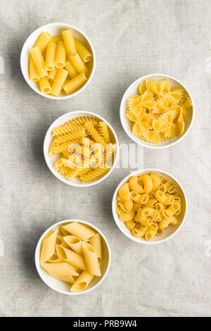 Various types of italian pasta in bowl. Top view. Stock Photo