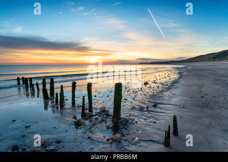 Stunning sunrise over Sandsend Beach near Whitby on the North Yorkshire Heritage Coast Stock Photo