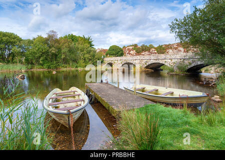 The  over the river Rhythallt as it flows out of Llyn padarn at Brynrefail near Llanberis in Snowdonia National park in Wales Stock Photo