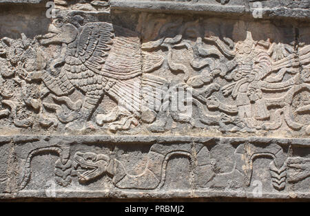 Bas-relief carving of eagle, chieftain and snake, pre-Columbian Maya civilization, Chichen Itza, Yucatan, Mexico. UNESCO world heritage site Stock Photo