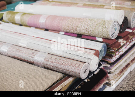 diversity of colour carpets in the store for home decor Stock Photo