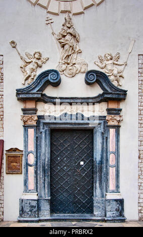 Baroque portal at Romanesque Church of St Adalbert aka Church of St Wojciech at Main Market Square in Krakow, Poland Stock Photo