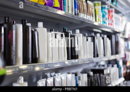 Shelves with hair care products in a cosmetics showroom indoor Stock Photo