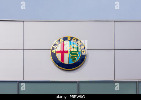 Alfa Romeo logo on dealership building Stock Photo - Alamy