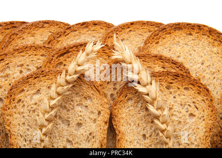toast in slices and two ears of wheat Stock Photo
