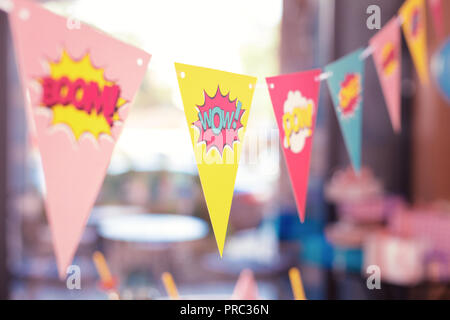 Close up of colorful party flags placed in the room Stock Photo