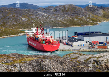 Royal Arctic Line container ship Irena Arctica (424 TEU) docked in port in fjord. Paamiut (Frederikshåb), Sermersooq, southwestern Greenland. Stock Photo